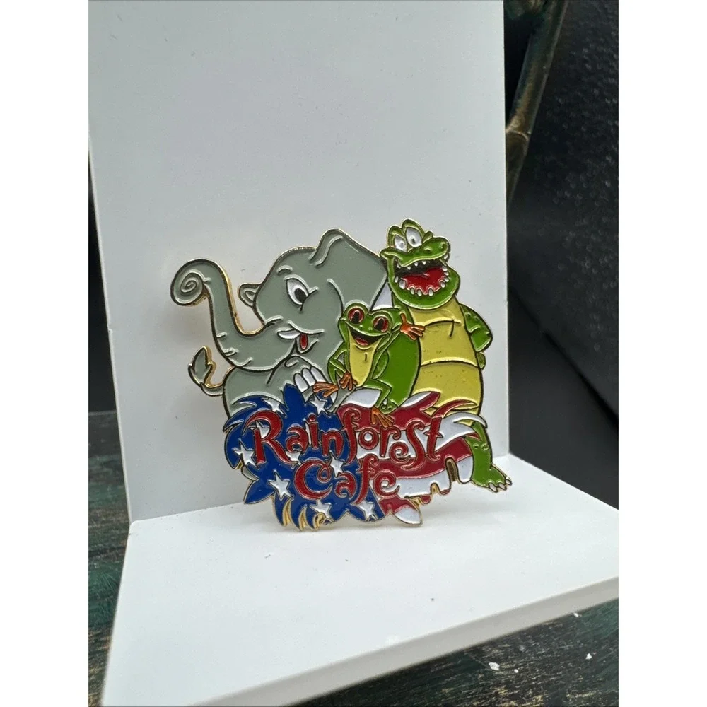 Rainforest Cafe Pin Featuring Nike, Cha Cha, Tuki American Flag